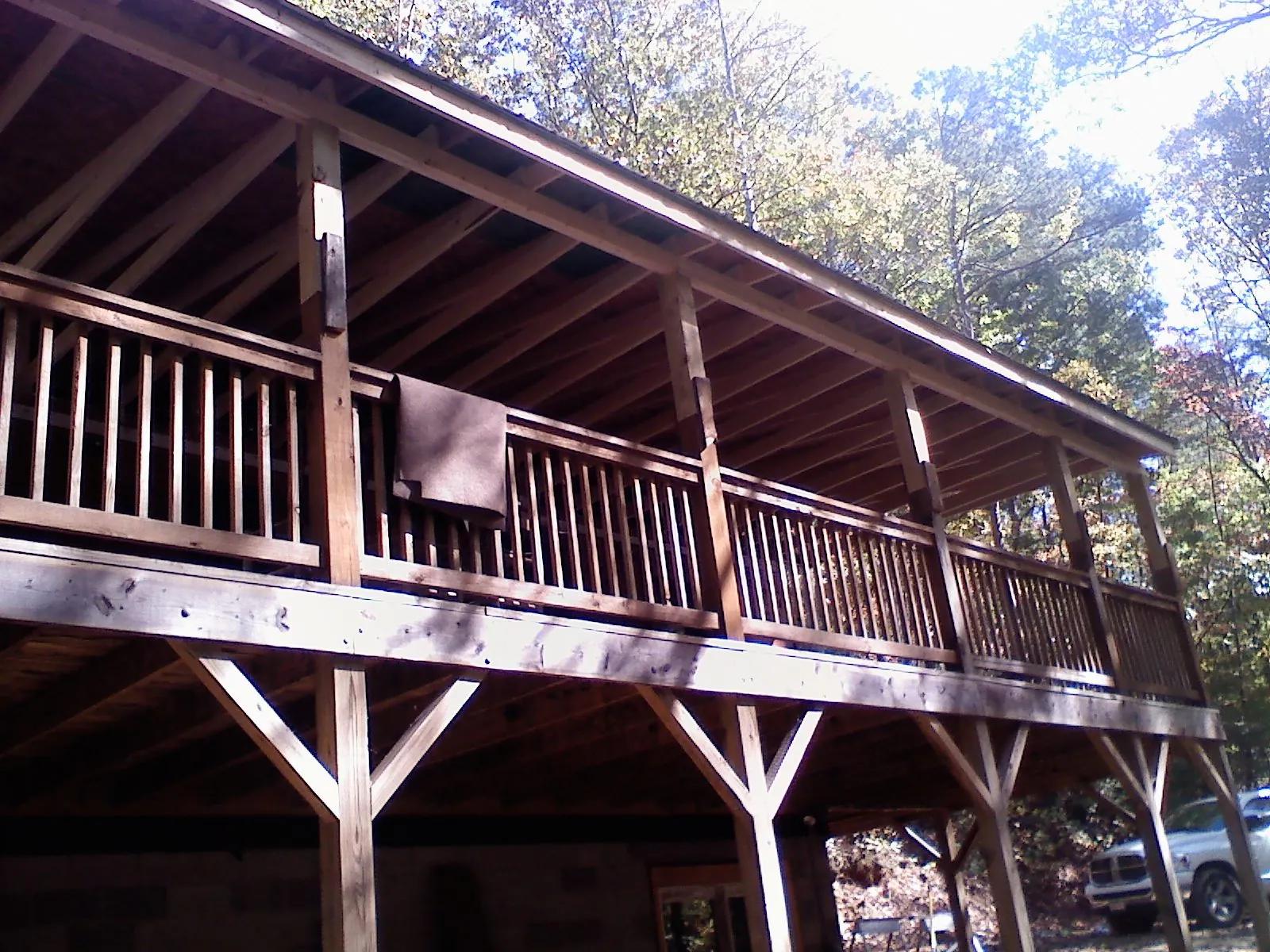 Timber framing under a new elevated porch and deck — Roof Leak Repair in Moundridge by Roofing Brothers